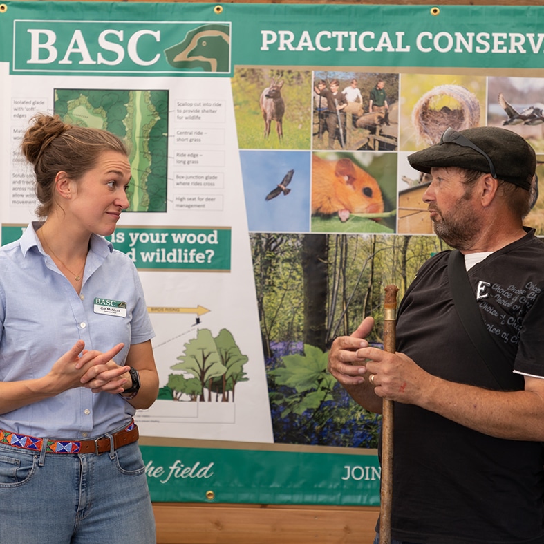 A BASC staff member talking to a member of the public