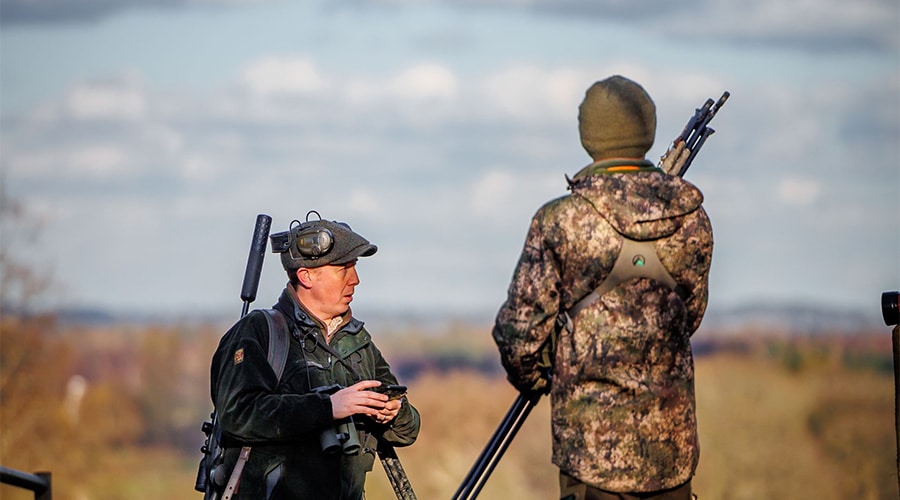 Two shooters in a field