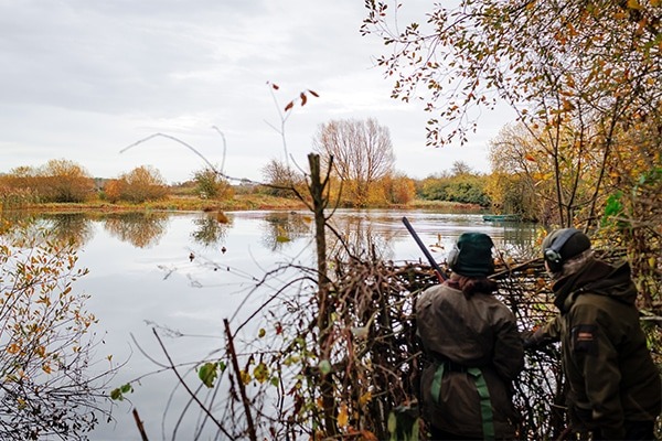 Wildfowlers in a hide watching